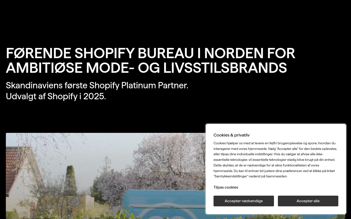 The desktop homepage features a dark, minimalist design with large white headlines. A hero section displays a large image slider showcasing various client case studies like Hjem-is and Andersen-Andersen, followed by a grid of portfolio projects and a section about the agency's headquarters in Randers.
