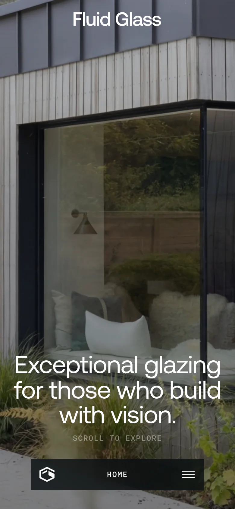 The mobile version presents a vertically oriented hero image of the same modern architectural glazing. The text is stacked vertically to fit the narrow screen, and the bottom navigation bar remains fixed, featuring the logo, 'HOME' text, and a hamburger menu icon.