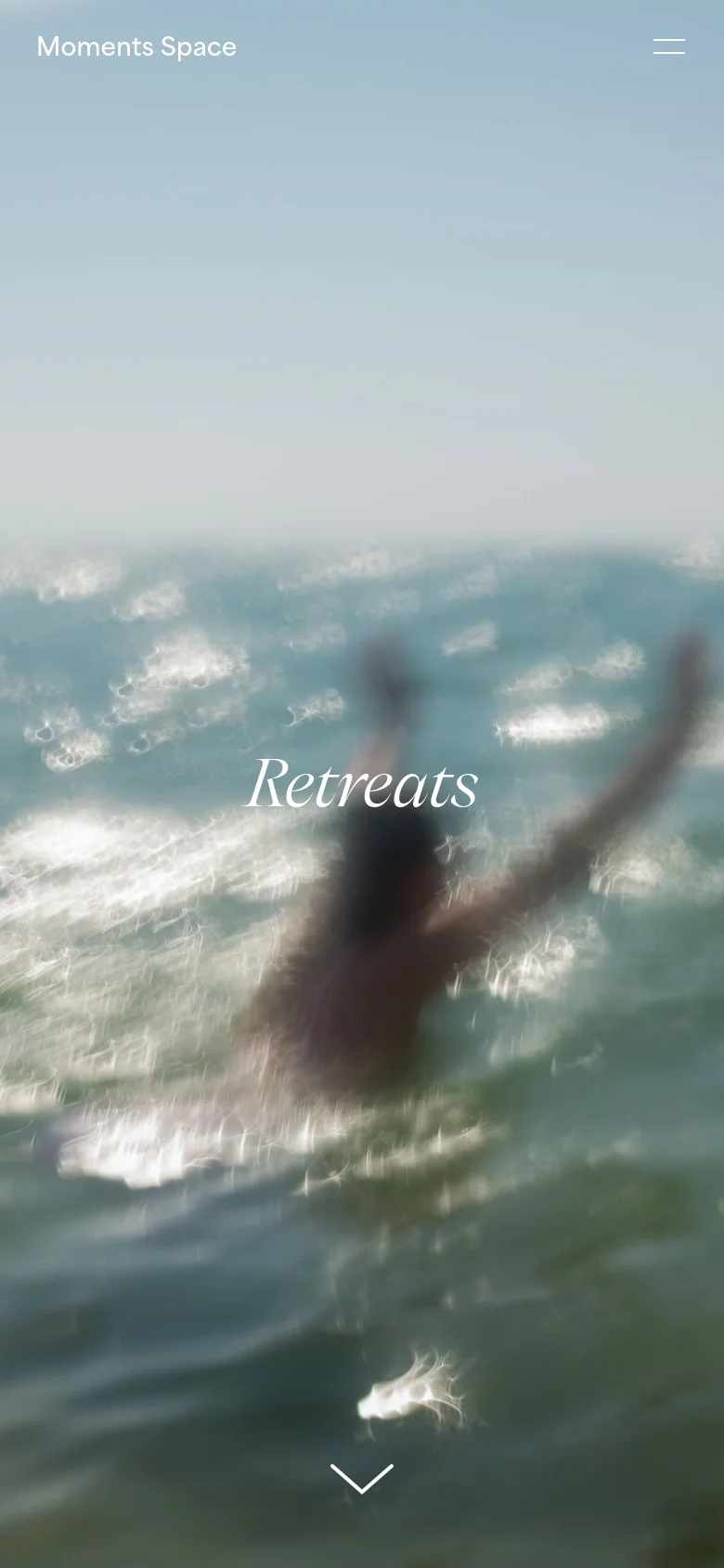 The mobile version maintains the blurred ocean hero image and centered 'Retreats' title but simplifies the navigation. The top menu is replaced by a hamburger icon on the right, while the brand name 'Moments Space' remains on the left. The layout is vertically oriented to fit a smartphone screen.
