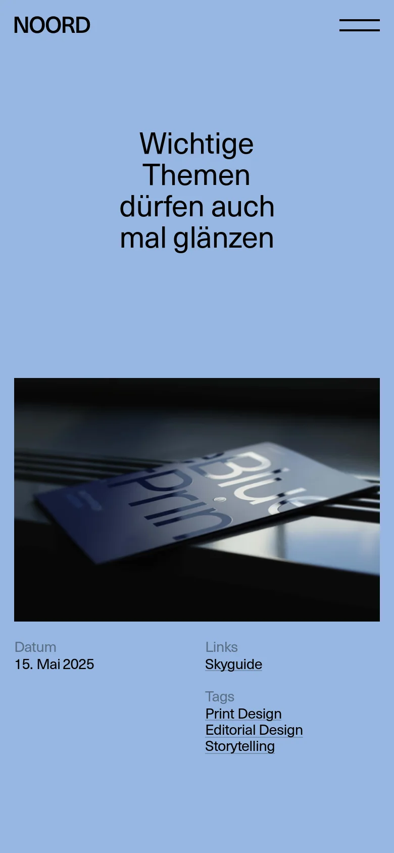 The mobile version maintains the light blue background and large black headline but uses a single-column vertical layout. The headline appears at the top, followed by the large magazine photograph, with the date, links, and tags listed underneath in a stacked format.