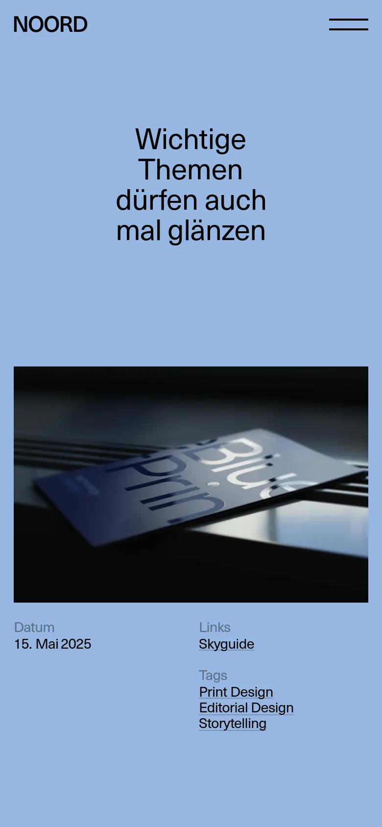 The mobile version maintains the light blue background and large black headline but uses a single-column vertical layout. The headline appears at the top, followed by the large magazine photograph, with the date, links, and tags listed underneath in a stacked format.