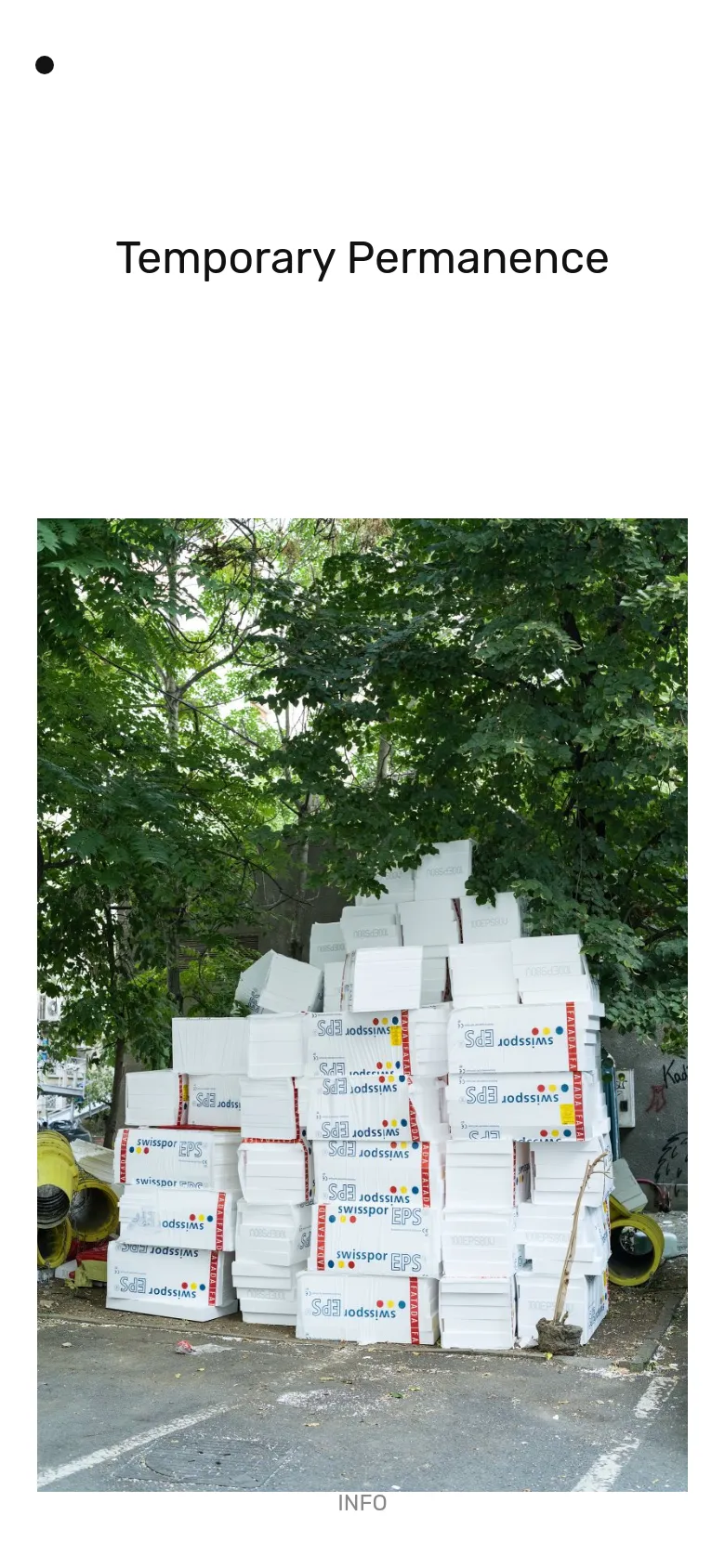 The mobile version presents a simplified, single-column layout with a large heading 'Temporary Permanence' at the top. Below the heading, the same vertical photograph of white Styrofoam boxes under green trees fills the width of the screen, followed by an 'INFO' link at the bottom.