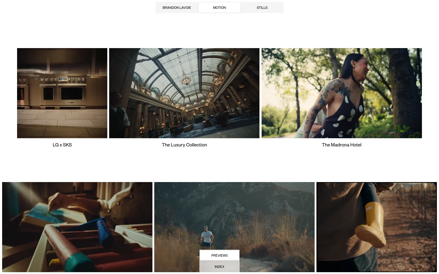 A minimalist portfolio website for Brandon Lavoie featuring a clean white background and a navigation menu with 'BRANDON LAVOIE', 'MOTION', and 'STILLS'. The main content is a grid of large, cinematic rectangular video thumbnails with titles underneath, such as 'LG x SKS' and 'The Luxury Collection'.