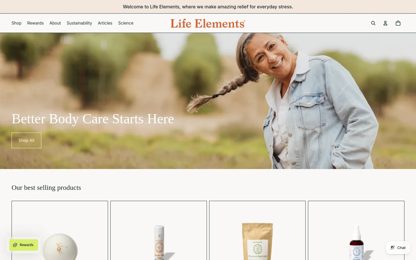 The desktop homepage features a wide hero banner with a smiling woman in a field and the headline 'Better Body Care Starts Here' next to a 'Shop All' button. A navigation menu sits at the top with links for Shop, Rewards, and About, while a product grid titled 'Our best selling products' displays items like CBD bath bombs below the hero section.