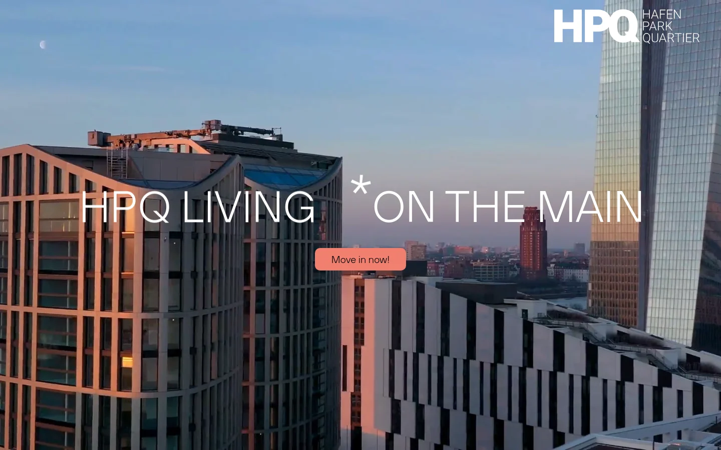 Desktop view of the HPQ Living homepage featuring a large hero image of modern high-rise buildings against a sunset sky with the headline 'HPQ LIVING * ON THE MAIN'. A salmon-colored 'Move in now!' button is centered, and the HPQ Hafenpark Quartier logo is in the top right corner.