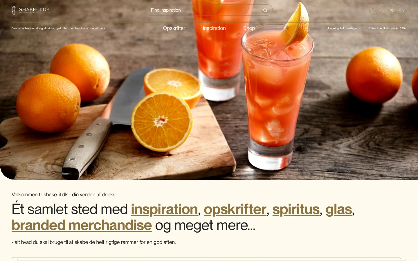 The desktop homepage features a large hero image of orange cocktails and sliced oranges on a wooden surface. A navigation menu at the top includes links for Opskrifter, Inspiration, and Shop, alongside a search bar and user icons. Below the hero section, a large headline welcomes users to the site with underlined links for inspiration, recipes, spirits, glassware, and merchandise.