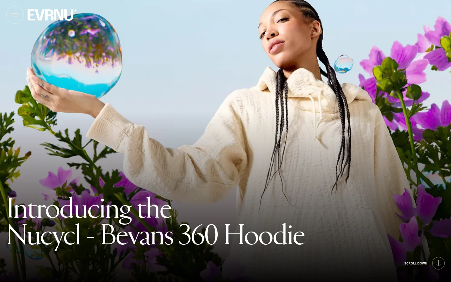The desktop homepage features a large hero image of a person in a cream-colored hoodie holding a water bubble against a background of purple flowers. The headline 'Introducing the Nucycl - Bevans 360 Hoodie' is overlaid in white serif text, with a 'Scroll Down' prompt at the bottom right. The layout is clean with a minimalist white logo in the top left corner.