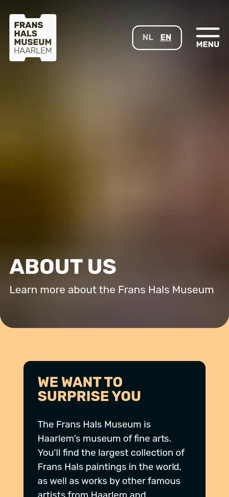 The mobile version presents a vertically stacked layout starting with a large hero image area containing the 'ABOUT US' headline. The navigation is simplified, featuring the museum logo, a language toggle, and a hamburger menu icon. The dark navy content box with the heading 'WE WANT TO SURPRISE YOU' spans the width of the screen below the hero section.