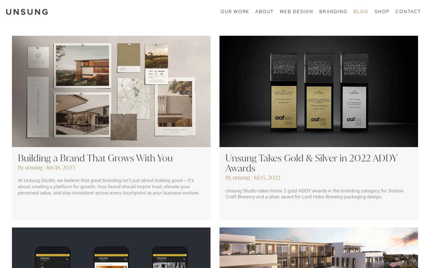 The blog page features a clean, minimalist layout with a white background and black typography. Content is organized in a two-column grid of large cards, each containing a high-quality hero image, a serif headline, author details, and a brief text excerpt. The navigation menu is at the top right, featuring links like Our Work, About, and Blog.