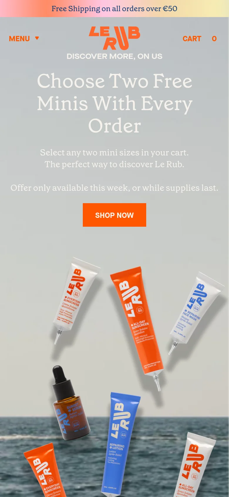 The mobile version uses a vertical layout with the 'Choose Two Free Minis' headline and 'SHOP NOW' button centered prominently. The hero imagery of skincare products against the ocean is stacked vertically. Navigation is condensed into a 'MENU' dropdown on the top left, with 'CART' and a shopping bag icon on the right.