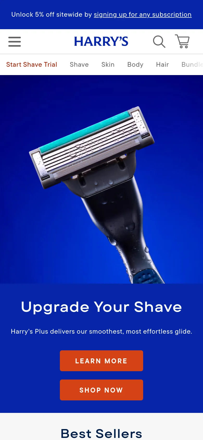 The mobile version presents a vertically stacked layout with the hero image of the razor at the top. The 'Upgrade Your Shave' headline and orange 'LEARN MORE' and 'SHOP NOW' buttons are centered below the image on a blue background. The navigation is condensed into a hamburger menu icon, the Harry's logo, a search icon, and a shopping cart icon.