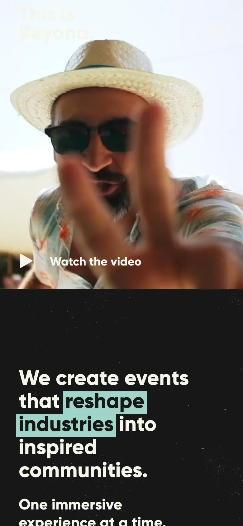 The mobile version presents a vertically stacked layout, starting with a full-width hero image of a man in a straw hat and sunglasses. Below the image, the headline 'We create events that reshape industries into inspired communities' is displayed in large white text against a dark, starry background. The navigation is condensed into a hamburger menu at the top right.