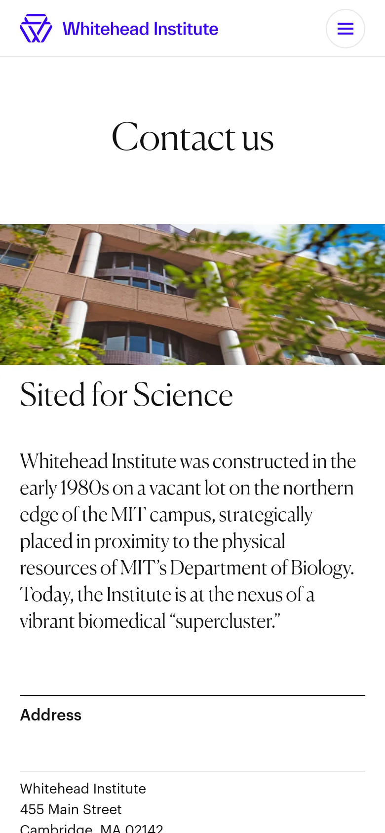 The mobile version presents a simplified layout with a condensed header containing the Whitehead Institute logo and a hamburger menu icon. The 'Contact us' headline and the building hero image remain prominent, but the content below is stacked vertically for easier scrolling on a narrow screen.