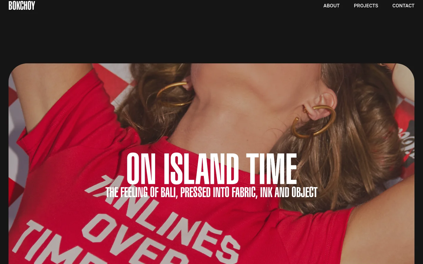 The Projects page features a minimalist black background with a navigation menu at the top right. Large, high-impact project tiles with bold white typography and full-width photography dominate the layout, showcasing projects like 'On Island Time' and 'Sista Dumpling'.