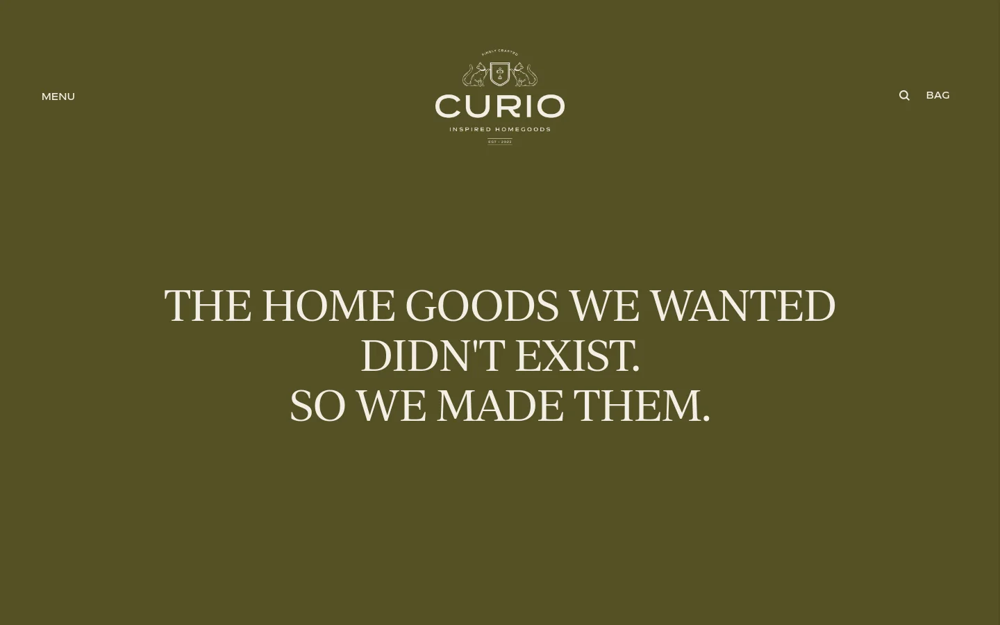 The About page features a minimalist design with a deep olive green background and white serif typography. A large headline reads, 'THE HOME GOODS WE WANTED DIDN'T EXIST. SO WE MADE THEM.' The header includes the Curio logo in the center, flanked by 'MENU' on the left and 'SEARCH' and 'BAG' on the right.