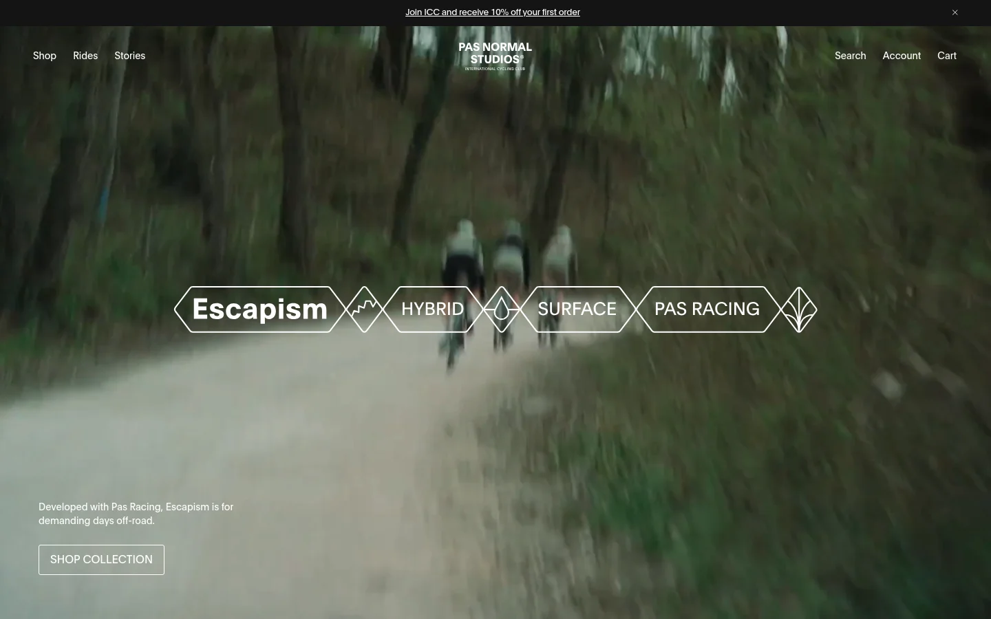 The desktop homepage features a full-width cinematic video background of cyclists riding through a forest. A central graphic overlay displays the words 'Escapism', 'Hybrid', 'Surface', and 'Pas Racing' in white text within geometric diamond shapes. A navigation bar sits at the top with links for Shop, Rides, and Stories, while a 'Shop Collection' call-to-action button is positioned in the bottom left corner.