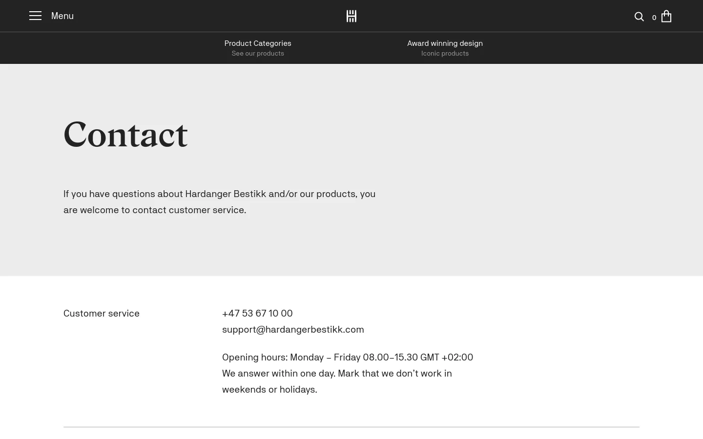The desktop Contact page features a minimalist design with a light gray background and a large serif 'Contact' headline. Below the headline is a brief introductory paragraph, followed by a section listing customer service contact details, including a phone number, email address, and opening hours in black text. A dark navigation bar at the top contains the menu, logo, search icon, and shopping bag.