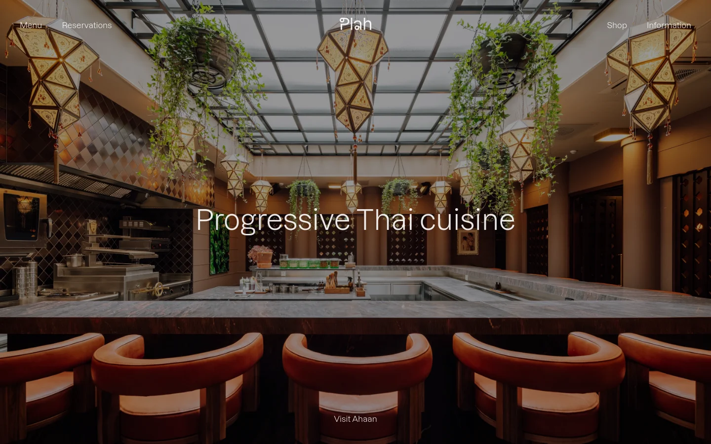 The desktop homepage features a large, high-quality background image of a modern restaurant interior with a marble bar, leather chairs, and ornate hanging lanterns. Centered white text reads 'Plah' at the top and 'Progressive Thai cuisine' in the middle, with a 'Visit Ahaan' call to action at the bottom. Navigation links for Menu, Reservations, Shop, and Information are positioned in the top corners.