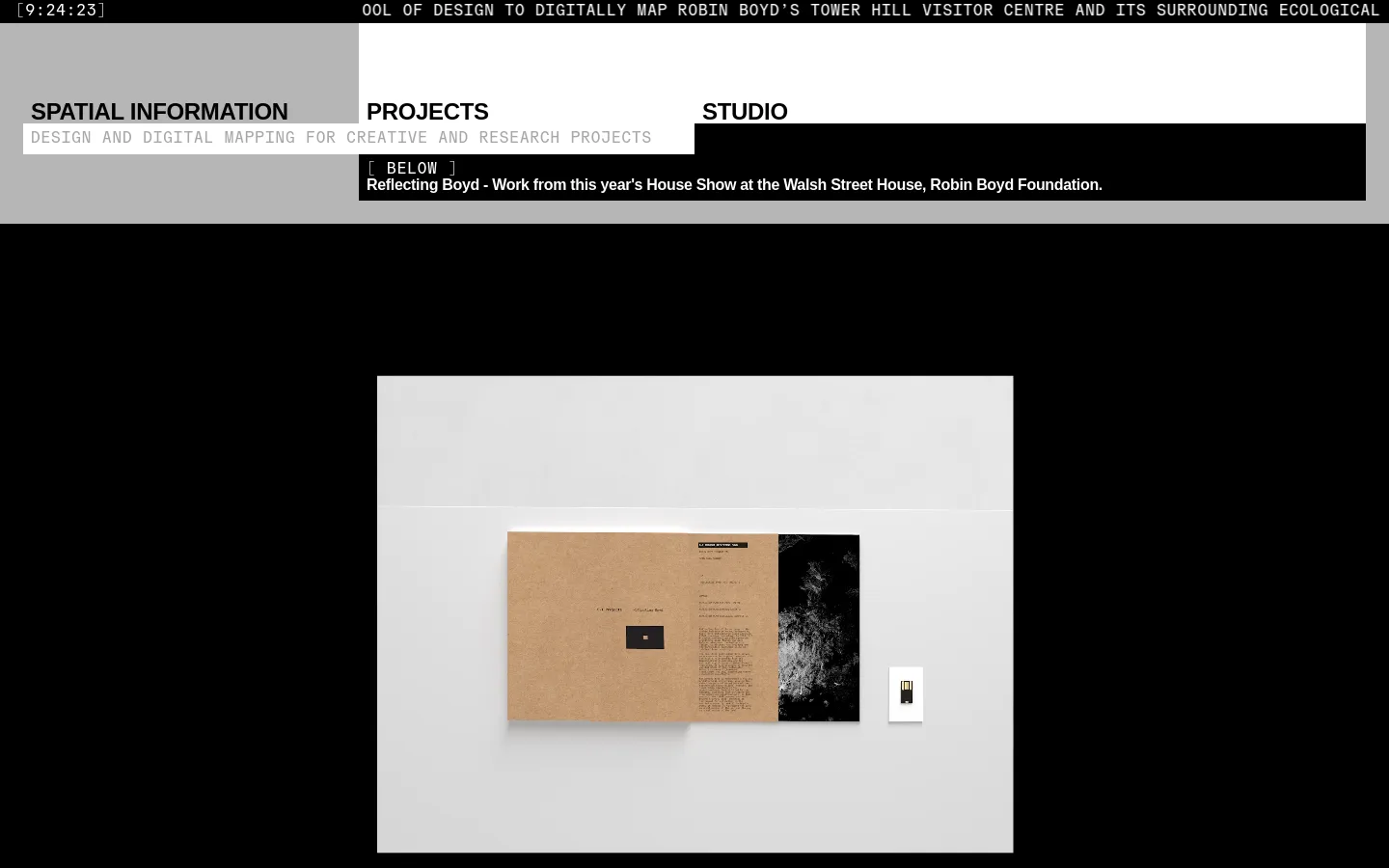 The desktop homepage features a minimalist black and white design with a navigation menu at the top including Spatial Information, Projects, and Studio. A large hero section displays a high-contrast photograph of an open book on a light surface, accompanied by text about the Robin Boyd Foundation. The layout is spacious with clean typography and a monochromatic color palette.