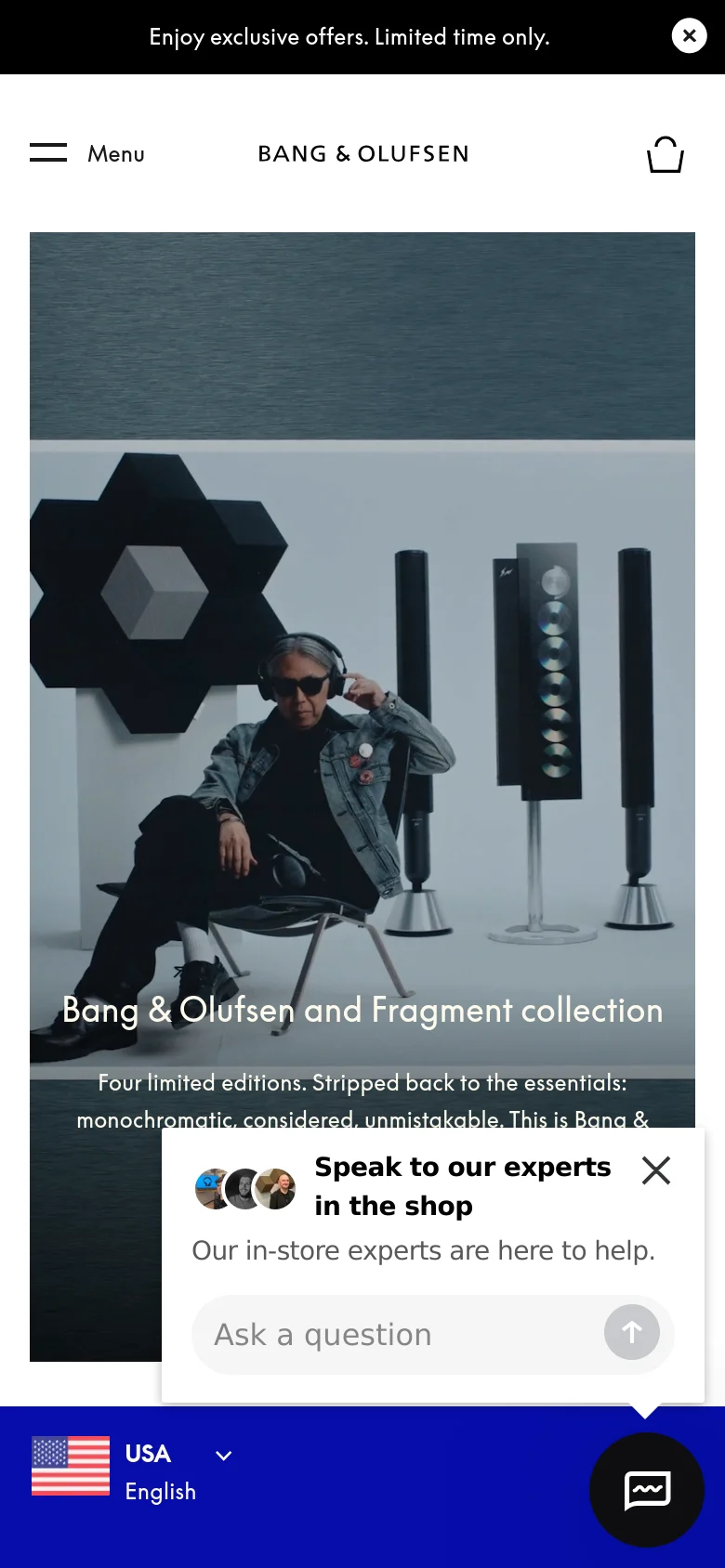 Mobile version of the homepage with a vertical layout. The hero section shows a person wearing headphones next to large speakers, with the 'Bang & Olufsen and Fragment collection' headline overlaid. The navigation is simplified to a hamburger menu, brand logo, and shopping bag icon, and a chat widget is visible in the bottom right corner.