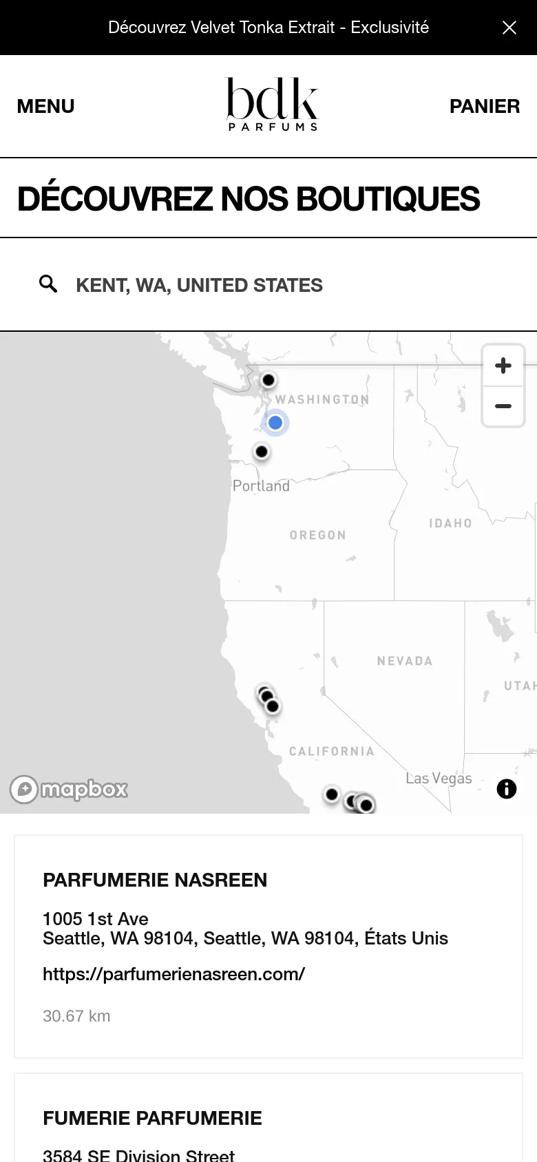 The mobile version maintains the white and grey aesthetic but uses a stacked layout. The header includes a hamburger menu and the brand logo, followed by the large 'DÉCOUVREZ NOS BOUTIQUES' title, a search bar, an interactive map, and a vertical list of boutique locations below the map.