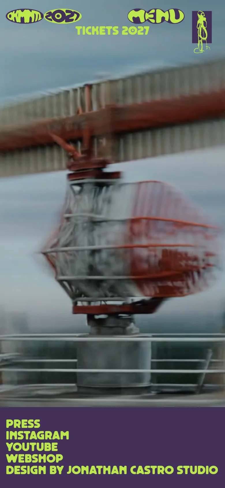 The mobile version simplifies the layout, replacing the top navigation with a large 'MENU' heading and a prominent 'TICKETS 2027' call to action. The background shows a blurred, motion-heavy image of an industrial cable car. The lime green footer links are stacked vertically against a solid dark purple background for easier scrolling.