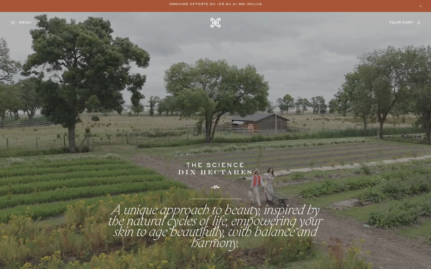 The desktop page features a wide hero image of a lush green field with trees and a small building under an overcast sky, with the text 'THE SCIENCE DIX HECTARES' centered. Below the hero, the layout uses a clean, minimalist aesthetic with ample white space, serif typography, and high-quality nature-inspired imagery. The color palette is dominated by earthy greens, browns, and soft neutrals.