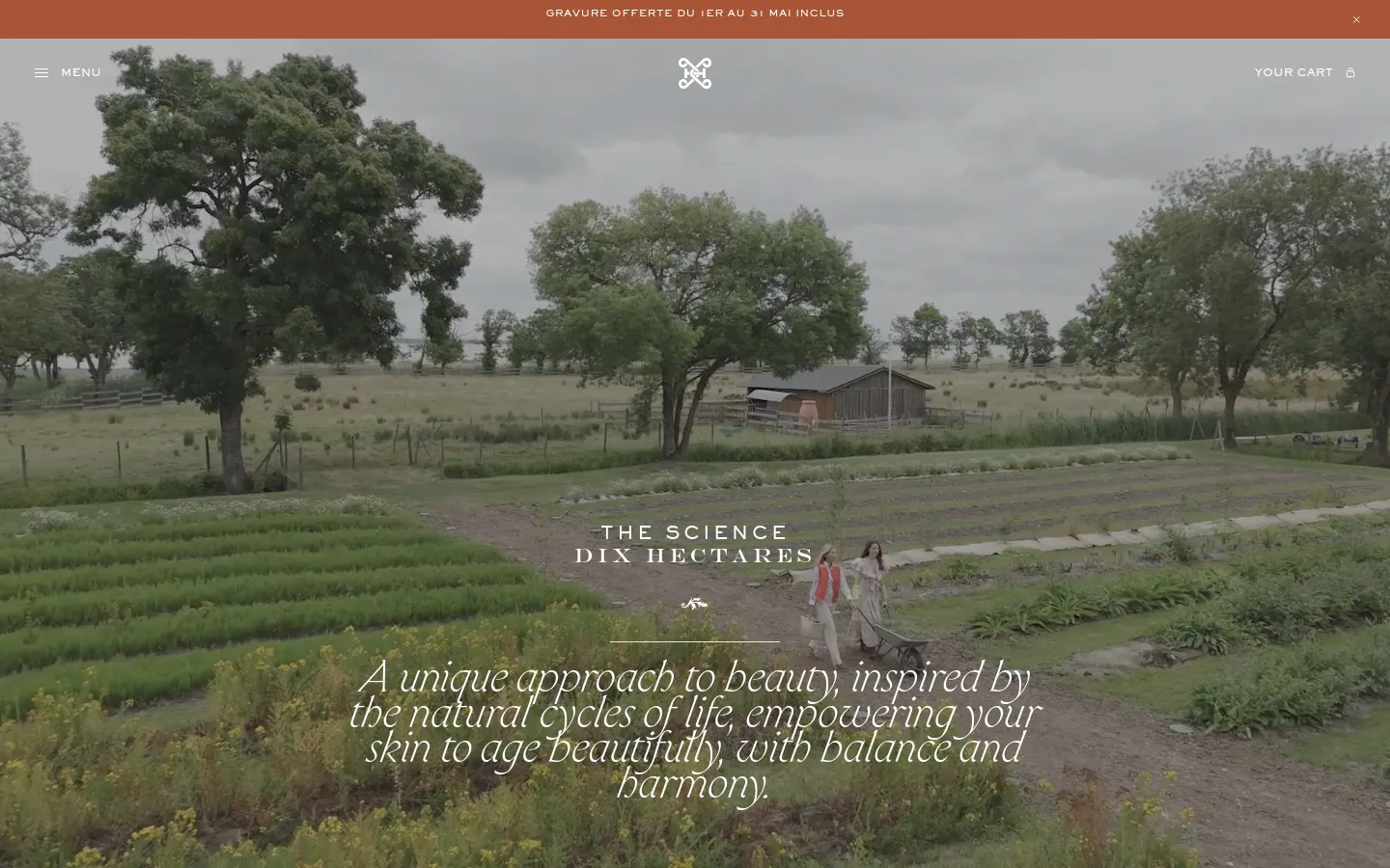 The desktop page features a wide hero image of a lush green field with trees and a small building under an overcast sky, with the text 'THE SCIENCE DIX HECTARES' centered. Below the hero, the layout uses a clean, minimalist aesthetic with ample white space, serif typography, and high-quality nature-inspired imagery. The color palette is dominated by earthy greens, browns, and soft neutrals.