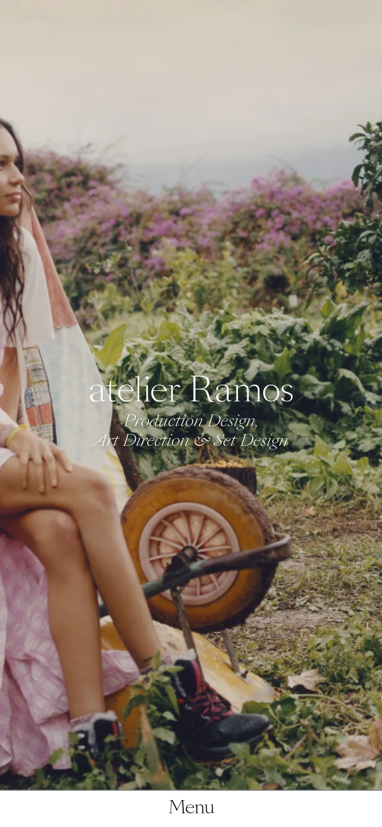 The mobile version presents a vertically stacked layout, beginning with a cropped, close-up version of the garden hero image and the studio name. The 'Menu' navigation is prominently placed at the bottom of the screen. The content is simplified to focus on a single-column view of the imagery.