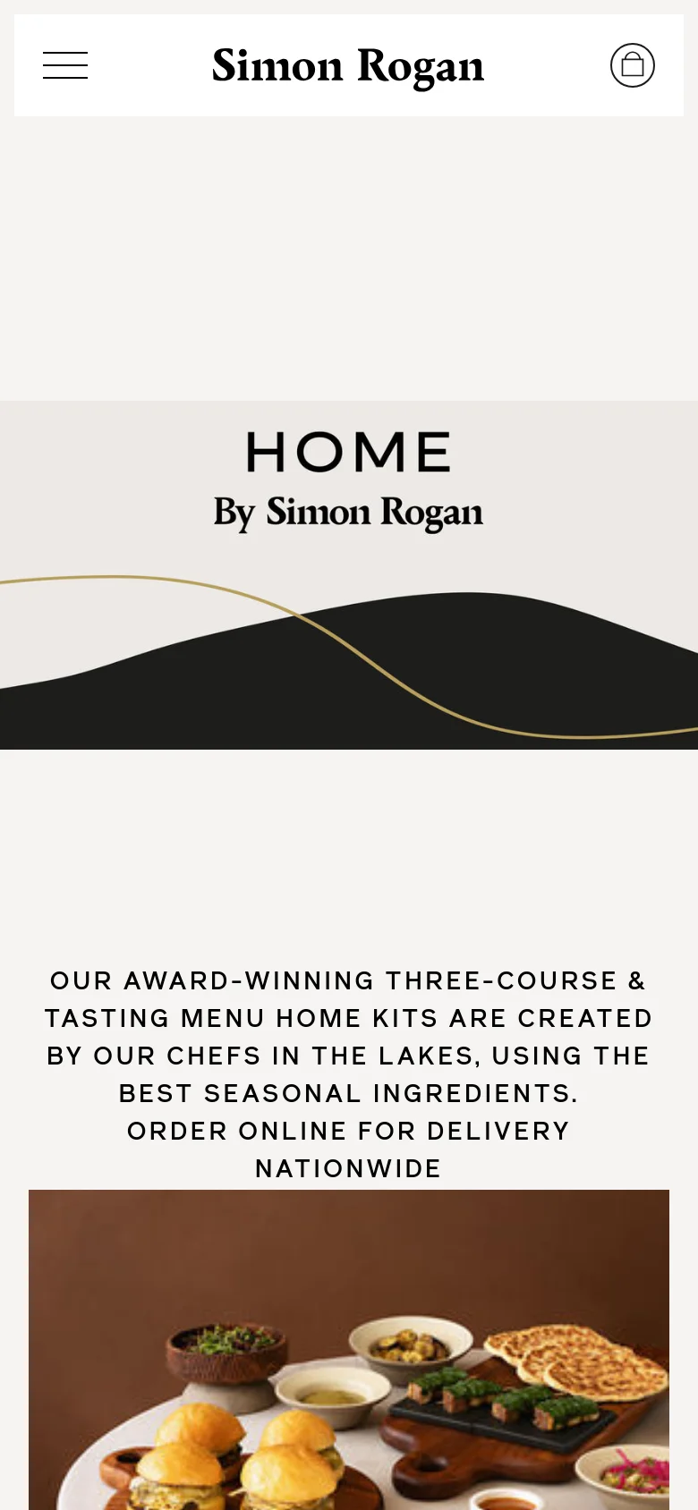 The mobile version presents a vertically stacked layout with the Simon Rogan logo and a shopping bag icon in the header. The hero section displays the 'HOME By Simon Rogan' title and graphic, followed by the descriptive text and a large food imagery section, with navigation condensed into a hamburger menu.