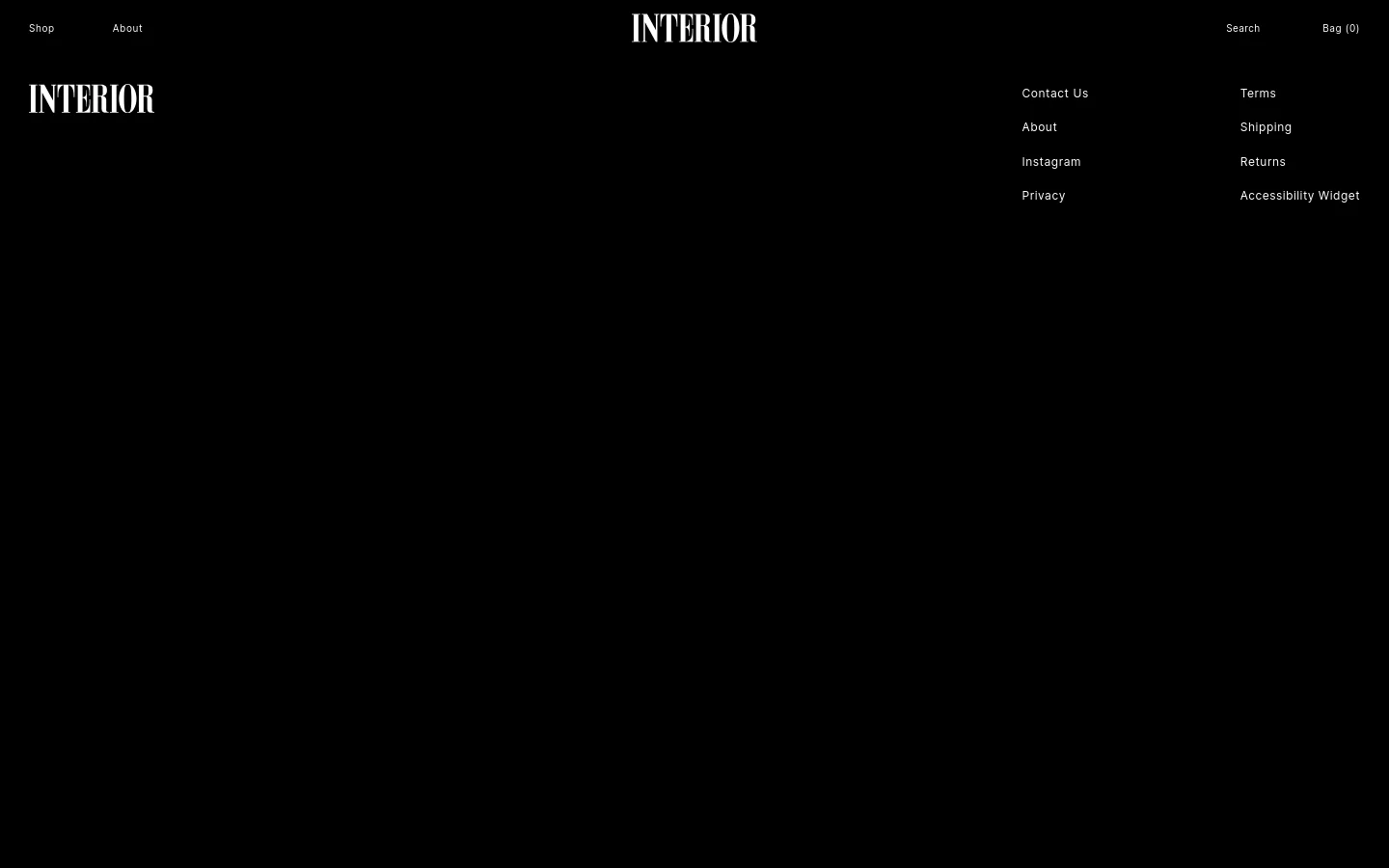 The desktop version of the 'Shop All' page features a minimalist black background with white text. The layout includes a centered 'INTERIOR' logo at the top, navigation links for 'About' on the left, and 'Search' and 'Bag (0)' on the right. A footer section contains two columns of links including Contact Us, About, Instagram, Privacy, Terms, Shipping, Returns, and Accessibility Widget.