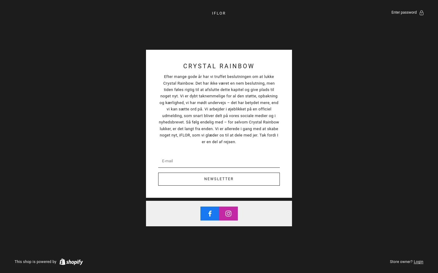 A minimalist desktop landing page with a dark charcoal background and a central white rectangular card. The card features the headline 'CRYSTAL RAINBOW' in black uppercase letters, followed by a long paragraph of Danish text, an email input field, and a 'NEWSLETTER' button, with social media icons for Facebook and Instagram at the bottom.