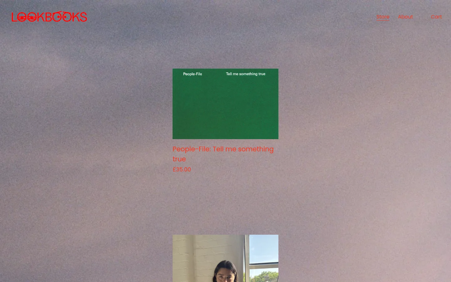 The LOOKBOOKS homepage features a minimalist design with a large, textured grey background. The red logo is in the top left, with navigation links for Store, About, and Cart on the right. A central product section displays a green book cover titled 'People-File: Tell me something true' priced at £35.00, positioned above a portrait photo of a person.