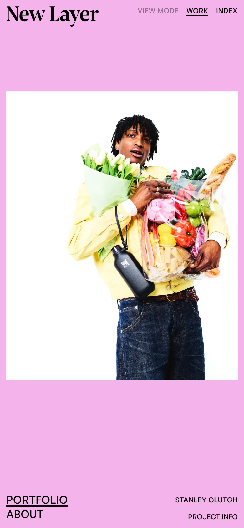 The mobile version presents a vertically stacked layout on a pink background, prioritizing the large hero image of a person with groceries. The 'New Layer' logo and navigation links are positioned at the top, while 'PORTFOLIO', 'ABOUT', and project-specific details like 'STANLEY CLUTCH' are placed at the bottom of the screen.