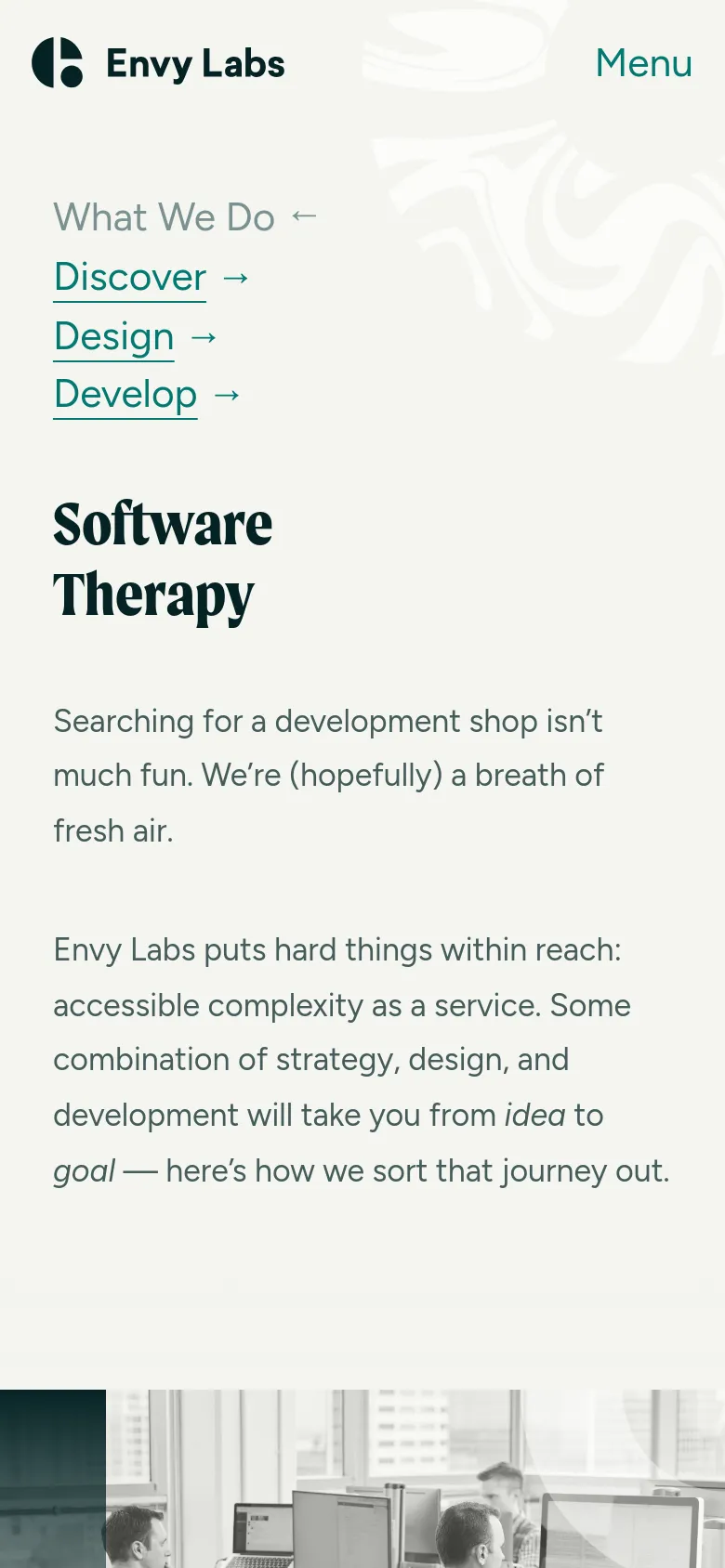 The mobile version uses a vertical stack layout with a simplified header containing the Envy Labs logo and a 'Menu' button. The 'What We Do' navigation links are listed vertically under the header, followed by the 'Software Therapy' headline and introductory text. The hero image is positioned below the text content instead of being side-by-side with the headline.