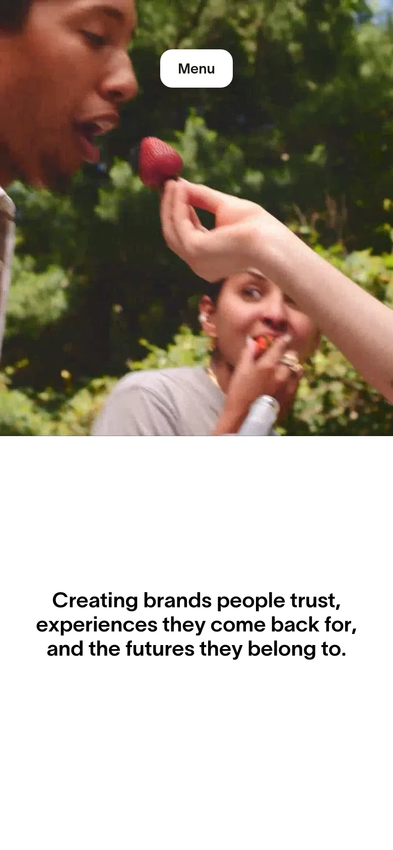 The mobile version maintains the minimalist aesthetic but optimizes the layout for a vertical screen. The hero image is cropped to focus on the subjects, and the headline text is centered and stacked to fit the narrower viewport width.