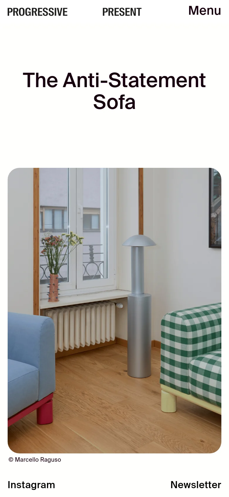 Mobile view of the article page featuring a centered, large headline 'The Anti-Statement Sofa'. Below the headline, a large vertical photograph shows a modern room interior with colorful sofas and a silver lamp. The navigation is condensed into a 'Menu' button at the top right, and footer links for Instagram and Newsletter are at the bottom.
