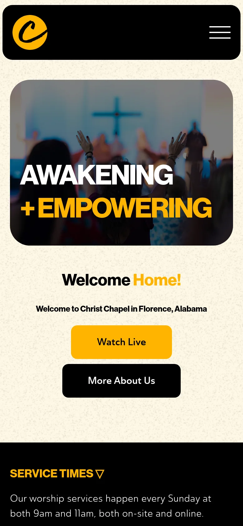 The mobile version displays a black header with a yellow logo and a hamburger menu icon. The hero section features the same 'AWAKENING + EMPOWERING' image with raised hands, followed by a 'Welcome Home!' heading and two large stacked buttons: a yellow 'Watch Live' button and a black 'More About Us' button.