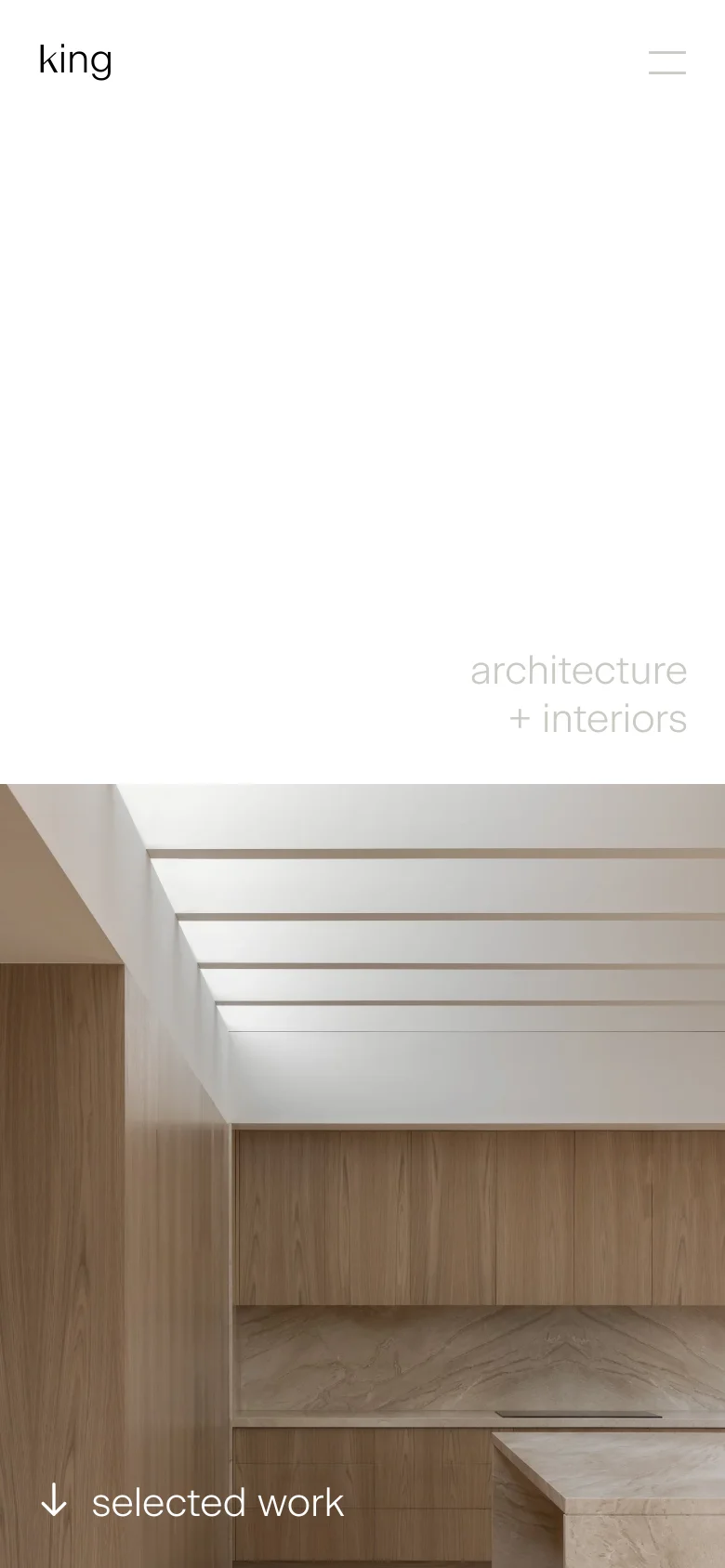 The mobile version maintains the minimalist aesthetic, showing a vertically oriented view of the modern interior with light wood textures and white architectural beams. The layout is simplified with the 'king' logo at the top left, a hamburger menu icon at the top right, and the 'selected work' text at the bottom left.