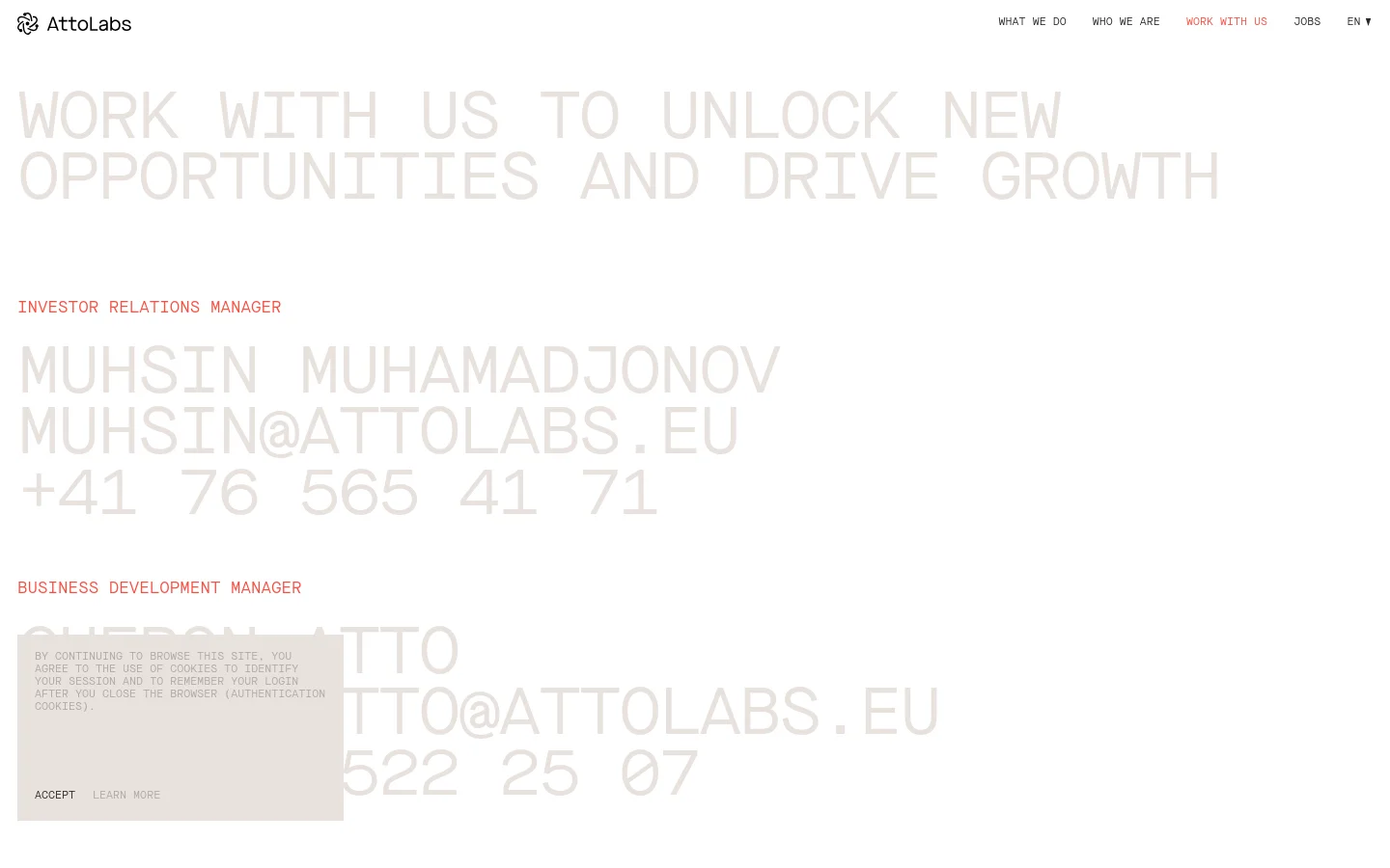 The desktop page features a minimalist design with a dark background and large, light-colored typography. A hero headline reads 'WORK WITH US TO UNLOCK NEW OPPORTUNITIES AND DRIVE GROWTH,' followed by contact sections for an Investor Relations Manager and a Business Development Manager, including names, emails, and phone numbers. The navigation bar at the top includes links for 'What we do,' 'Who we are,' 'Work with us,' and 'Jobs.'