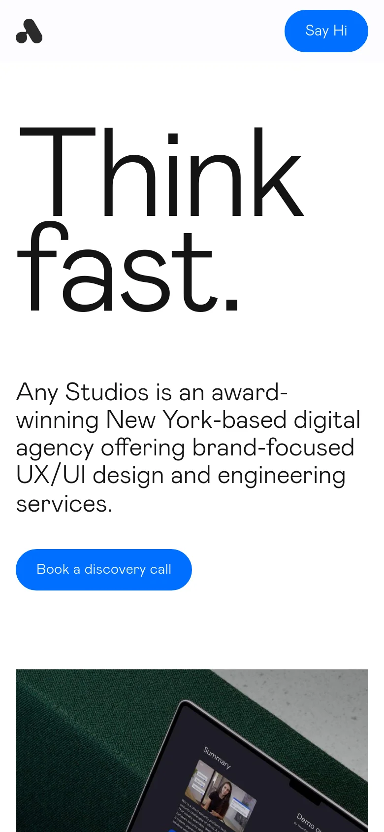 The mobile version maintains the minimalist white aesthetic but uses a stacked layout. The large 'Think fast.' headline dominates the top of the screen, followed by the agency description and a prominent blue 'Book a discovery call' button, with a partial view of a project image appearing at the bottom.