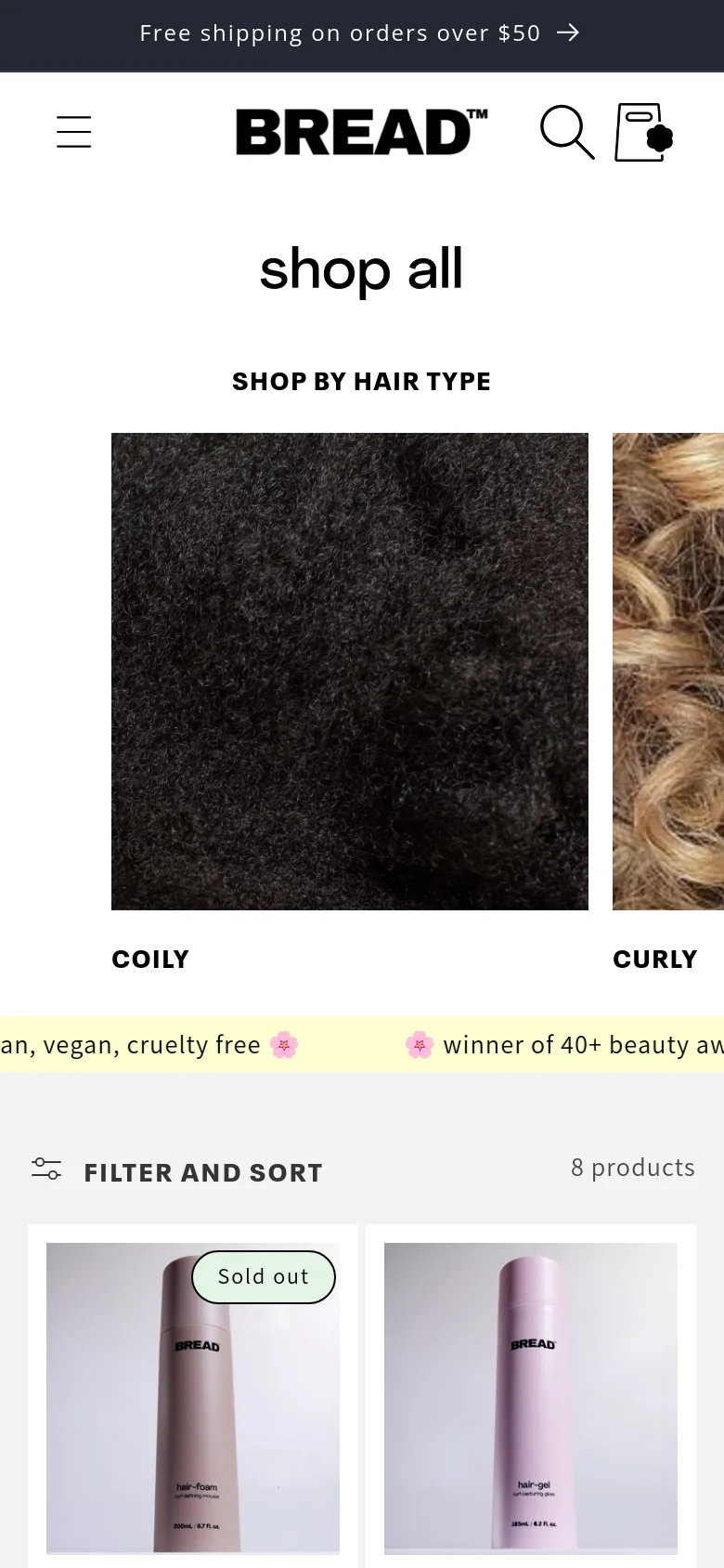 The mobile version simplifies the layout, showing the 'shop all' headline and 'SHOP BY HAIR TYPE' section with hair texture images stacked or partially visible in a smaller viewport. The product grid is condensed, and the sidebar filter is replaced by a prominent 'FILTER AND SORT' button with an icon, optimizing the interface for vertical scrolling.