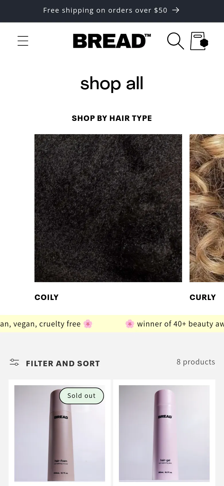 The mobile version simplifies the layout, showing the 'shop all' headline and 'SHOP BY HAIR TYPE' section with hair texture images stacked or partially visible in a smaller viewport. The product grid is condensed, and the sidebar filter is replaced by a prominent 'FILTER AND SORT' button with an icon, optimizing the interface for vertical scrolling.