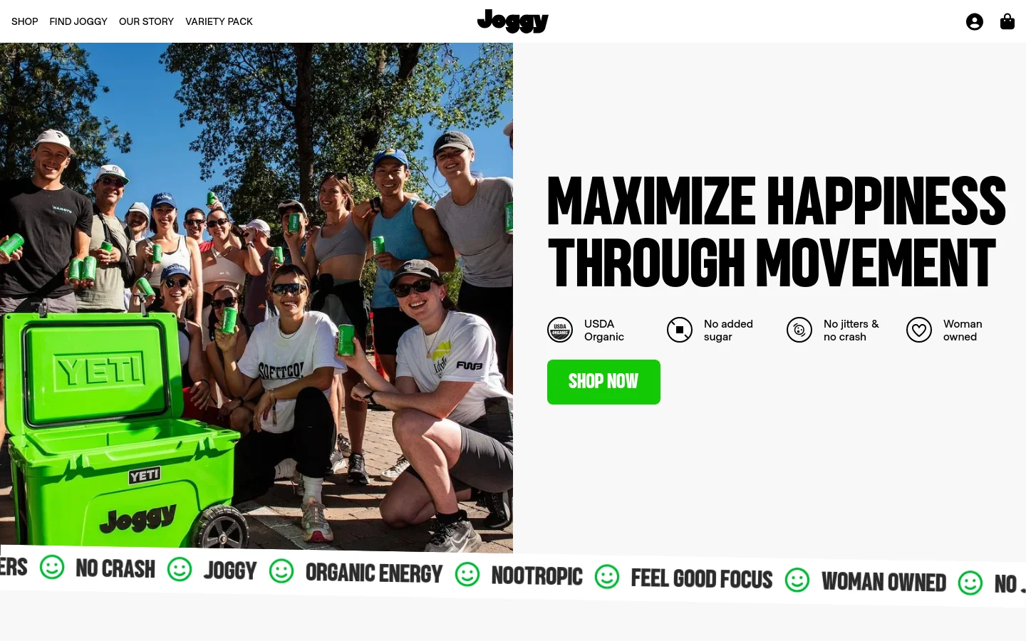 The desktop page features a large hero image of a diverse group of people smiling and holding green cans next to a bright green Yeti cooler. To the right, a large bold headline reads 'MAXIMIZE HAPPINESS THROUGH MOVEMENT' above four benefit icons and a bright green 'SHOP NOW' button. A scrolling marquee at the bottom lists brand attributes like 'NO CRASH' and 'ORGANIC ENERGY' in black text with green smiley face icons.