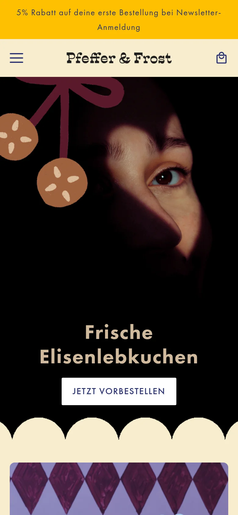 The mobile version displays a vertically stacked layout with the brand name and a hamburger menu at the top. The hero image shows a close-up of a person's face with large gingerbread graphics, followed by the headline 'Frische Elisenlebkuchen' and a centered white button. The design maintains the dark theme and cream scalloped accents seen on desktop but optimizes the navigation for a smaller screen.