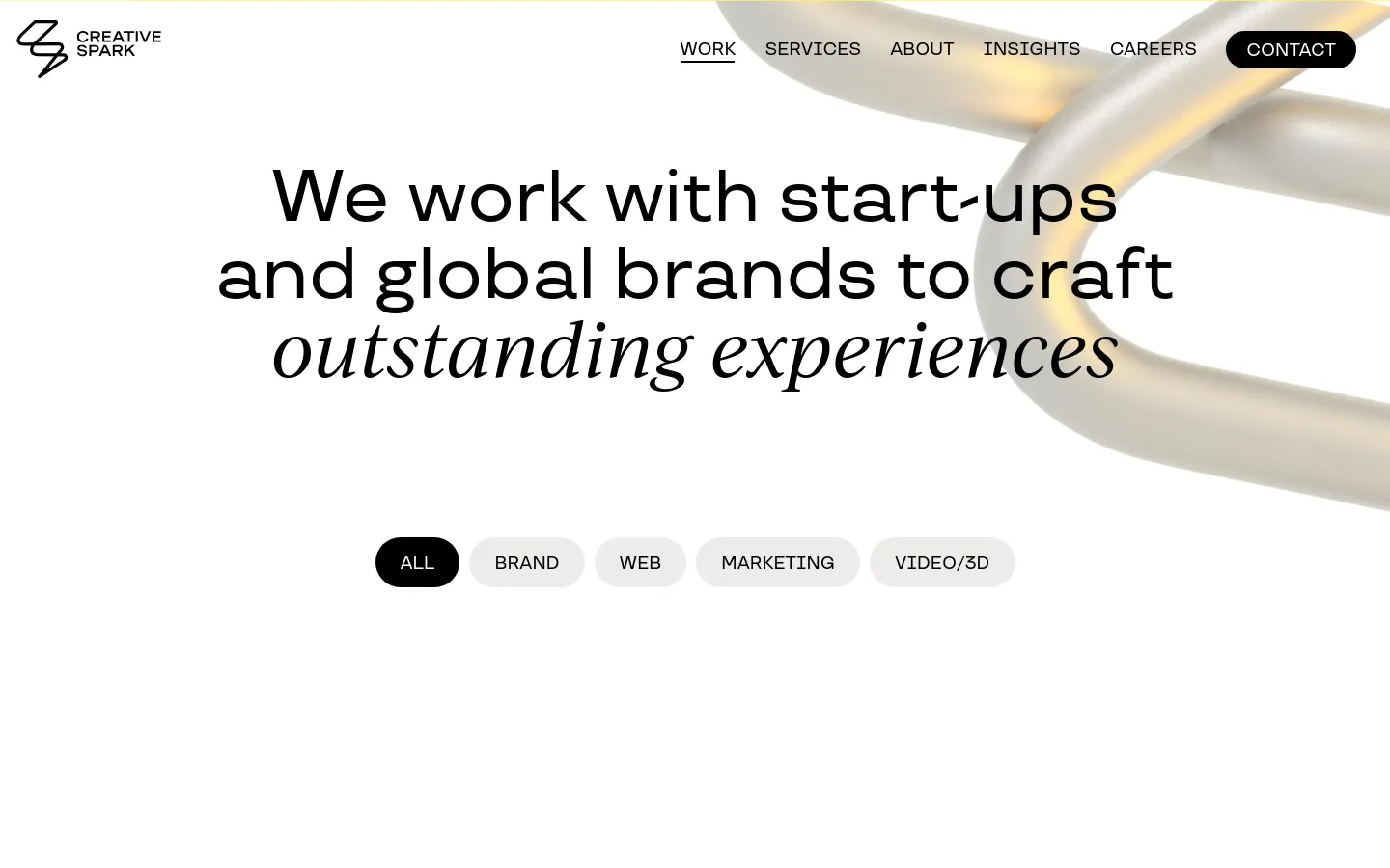 The desktop page features a clean, minimalist white background with a large headline reading 'We work with start-ups and global brands to craft outstanding experiences' overlaid on a large, abstract 3D metallic silver shape. Below the headline, a horizontal row of pill-shaped filter buttons includes 'ALL', 'BRAND', 'WEB', 'MARKETING', and 'VIDEO/3D'. The navigation bar at the top contains the Creative Spark logo and links for Work, Services, About, Insights, Careers, and a black 'CONTACT' button.