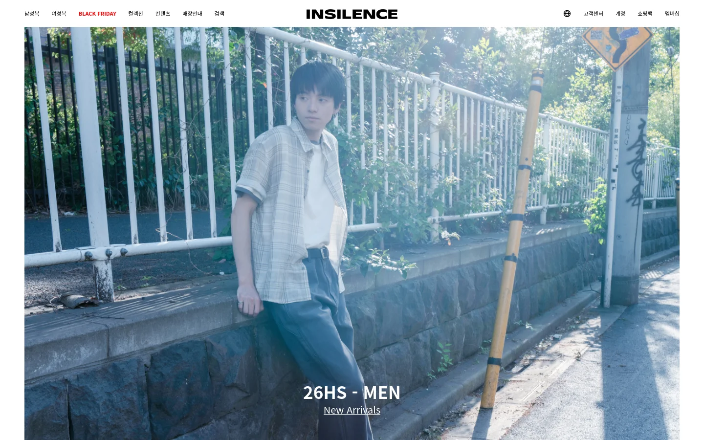 The desktop homepage for INSILENCE features a minimalist white header with navigation links for men's, women's, and Black Friday collections. A large hero image shows a young man in a plaid shirt leaning against a stone wall outdoors. The text '26HS - MEN' and a 'New Arrivals' link are centered at the bottom of the image.