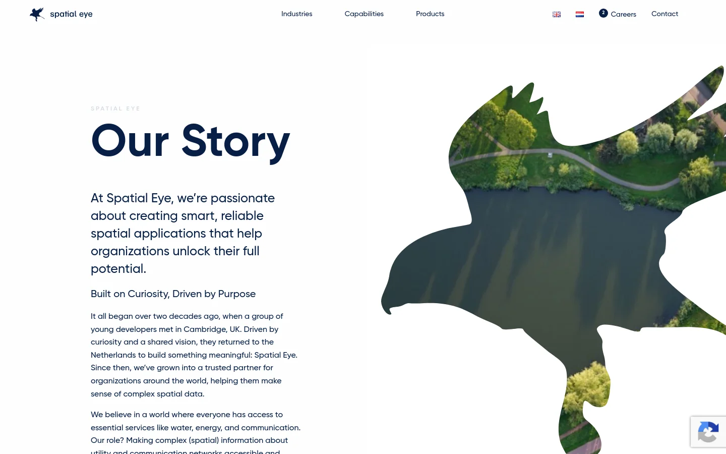 The desktop page features a clean white background with a large dark blue headline reading 'Our Story' and a subheadline about the company's passion for spatial applications. A large, stylized bird silhouette acts as a frame for an aerial landscape image of a river and greenery on the right side. The navigation menu is at the top, including links for Industries, Capabilities, Products, Careers, and Contact.