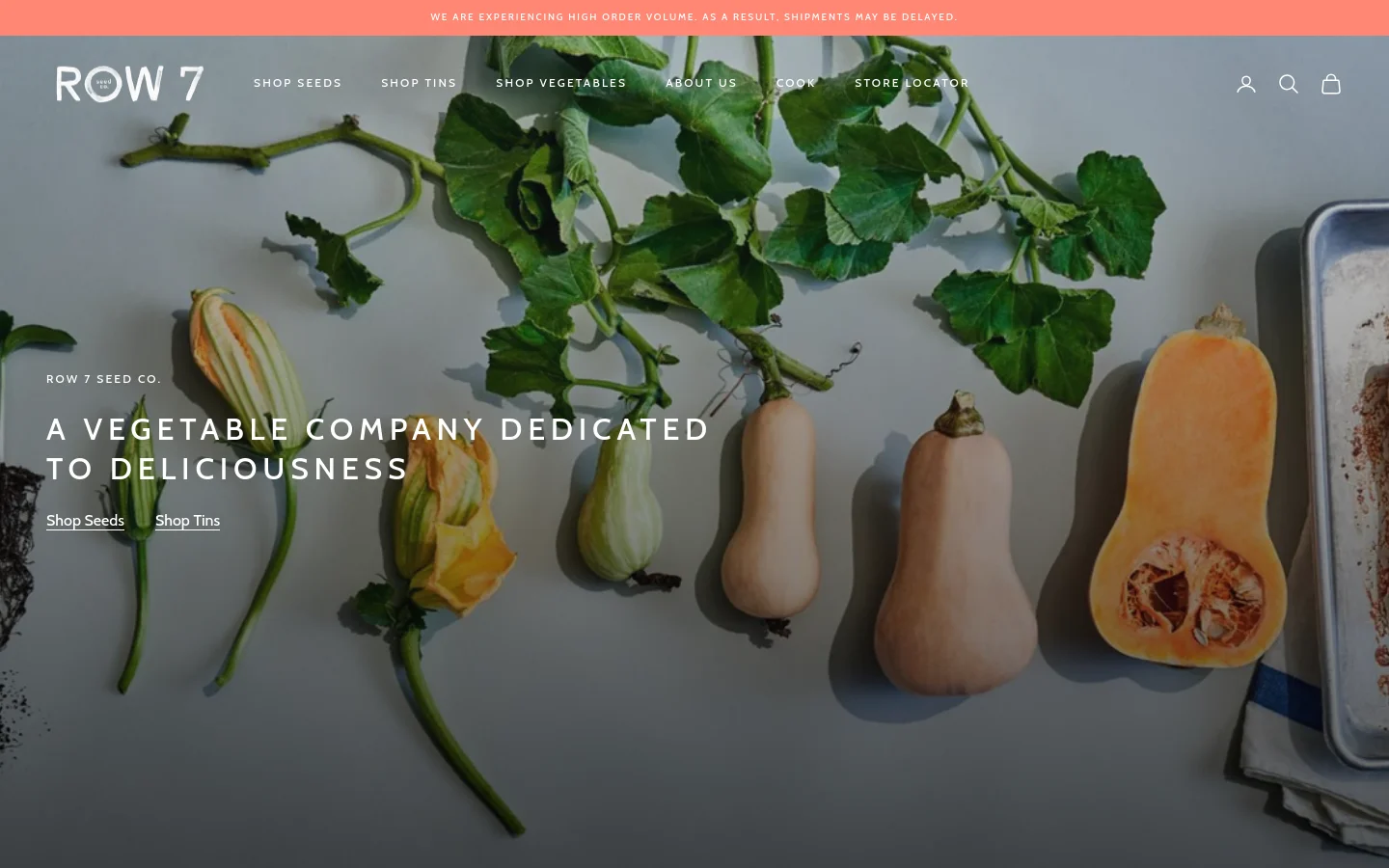 The desktop homepage features a large hero image of various squashes and leafy vines on a light background with the headline 'A vegetable company dedicated to deliciousness.' A navigation menu at the top includes links for Shop Seeds, Shop Tins, Shop Vegetables, About Us, Cook, and Store Locator. Below the hero section, a grid displays featured products like gift sets and seed packets with prices and images.