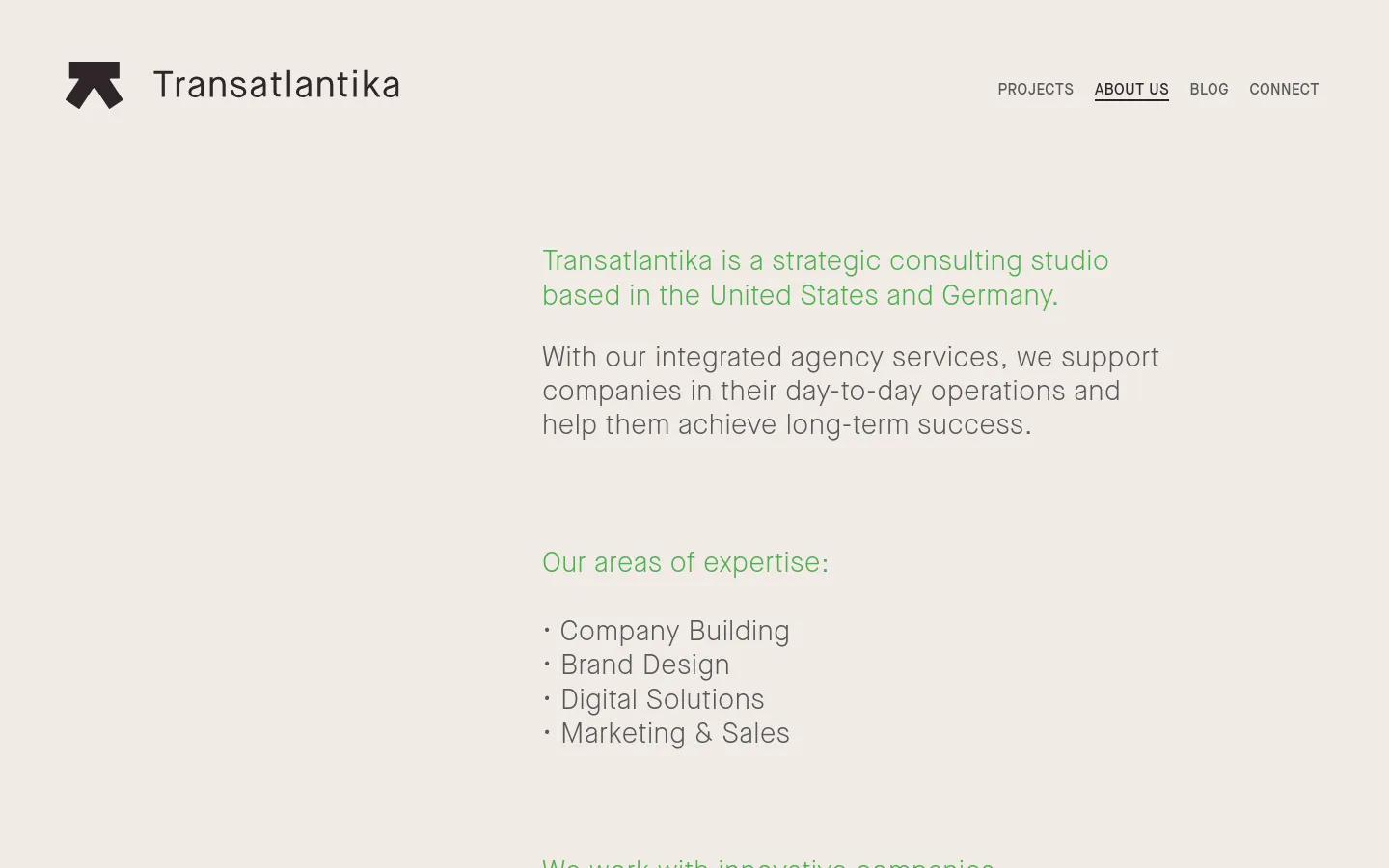 The About Us page features a minimalist design with a light beige background and green text. The layout consists of a clean header with the Transatlantika logo and navigation links, followed by large-scale typography describing the studio's mission and areas of expertise.
